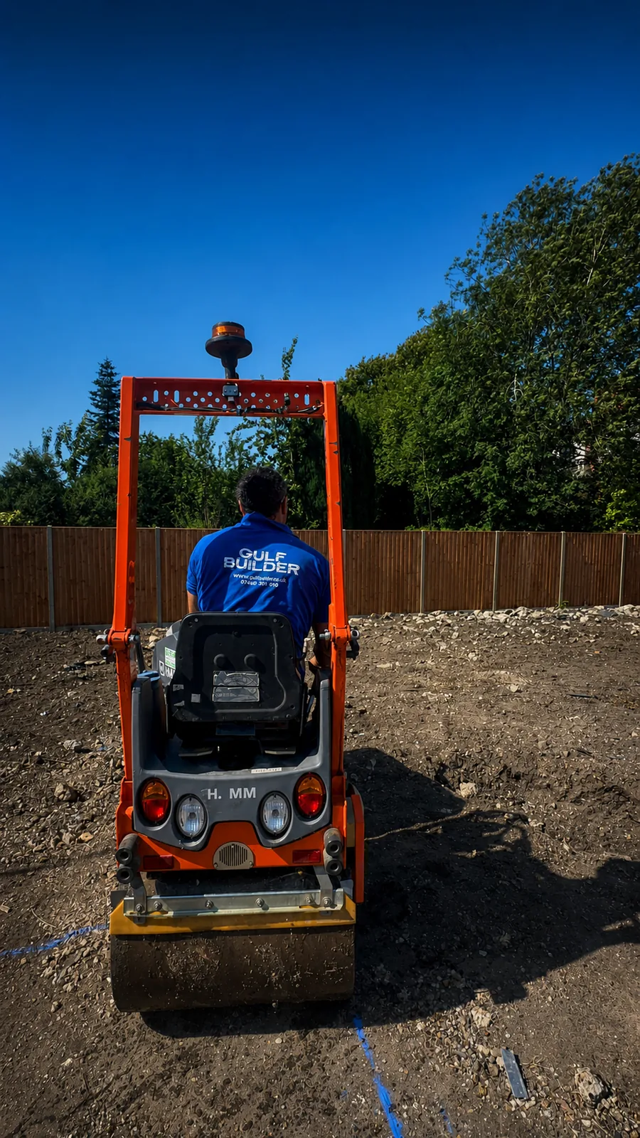 Gulf Builder compacting prepared ground for the car wash foundations