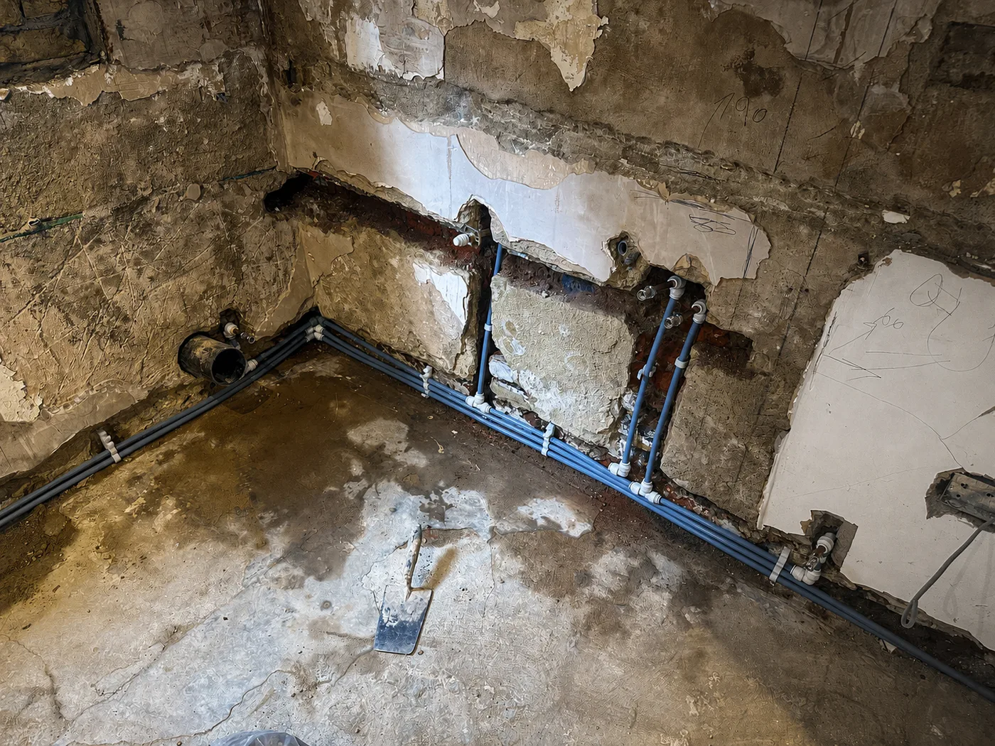 New plumbing routes installed during a kitchen and bathroom renovation