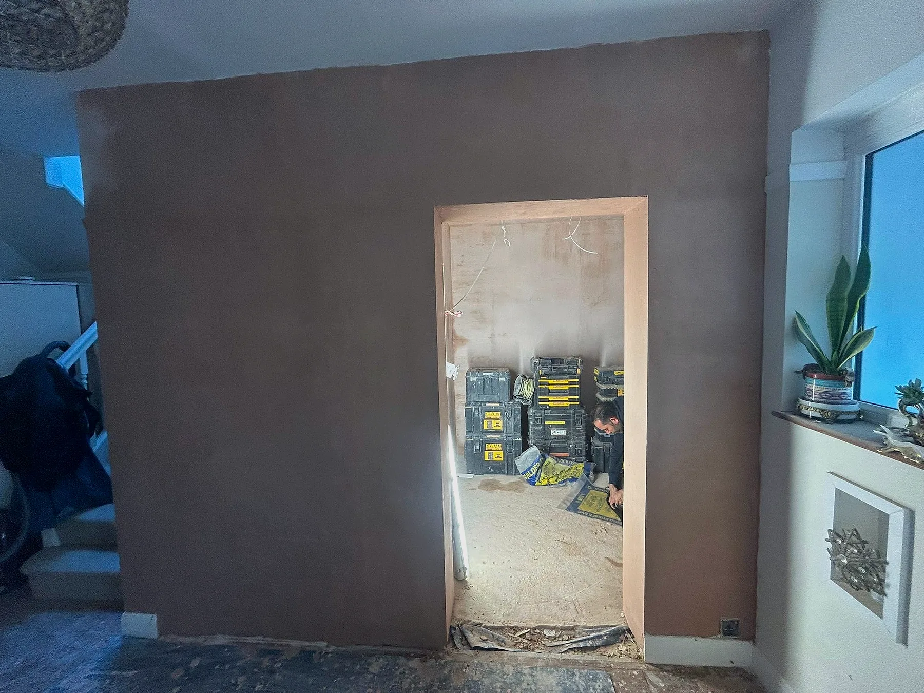 Wall preparation and plastering during a Gulf Builder kitchen renovation